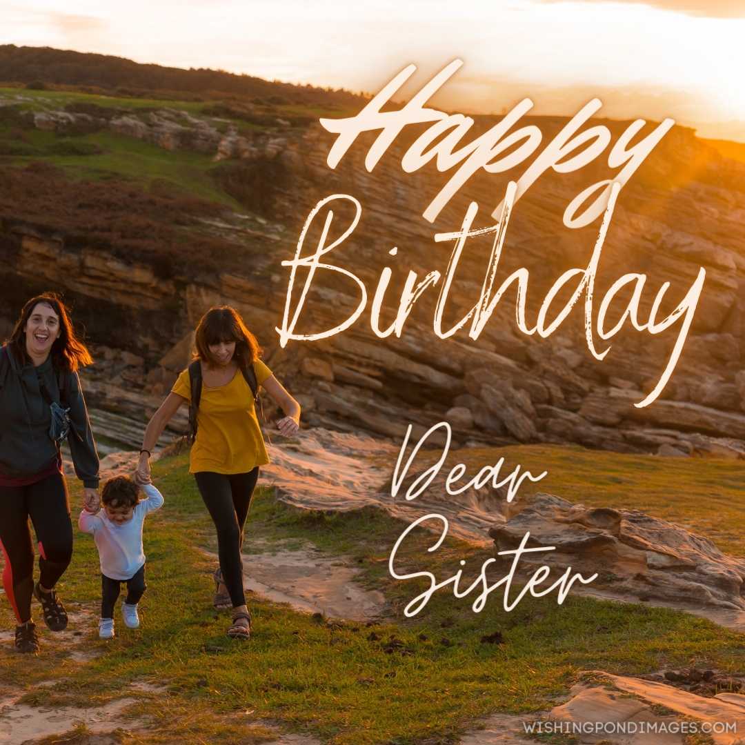 Two sisters with a child watching the sunset on the coast by the sea. Happy Birthday Sister Images